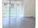 Bright living room with tile flooring and sliding glass doors at 1366 Yellow Finch Dr, Davenport, FL 33837
