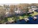 Waterfront property showcasing a large backyard and private dock at 1465 Riviera Dr, Kissimmee, FL 34744