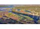 Wide aerial view of a lakefront community at 1465 Riviera Dr, Kissimmee, FL 34744