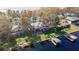 An aerial view of a waterfront home with private dock and beautiful lake views at 1465 Riviera Dr, Kissimmee, FL 34744