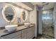 Bathroom with double sinks and a walk-in shower at 1465 Riviera Dr, Kissimmee, FL 34744
