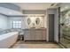 Bathroom boasts double sinks, a soaking tub and a walk-in shower at 1465 Riviera Dr, Kissimmee, FL 34744
