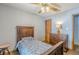 Bedroom with wooden bed frame and dresser at 1465 Riviera Dr, Kissimmee, FL 34744