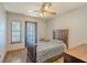 Cozy bedroom with water views and wood flooring at 1465 Riviera Dr, Kissimmee, FL 34744