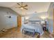 Bedroom with king-size bed and wood flooring at 1465 Riviera Dr, Kissimmee, FL 34744