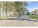 Gated entrance to a waterfront community with palm trees at 1465 Riviera Dr, Kissimmee, FL 34744