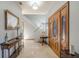 Bright entryway with hardwood floors, staircase, and wood door at 1465 Riviera Dr, Kissimmee, FL 34744
