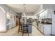Eat-in kitchen with granite countertops, stainless steel appliances and breakfast nook at 1465 Riviera Dr, Kissimmee, FL 34744