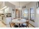 Bright kitchen with a breakfast nook overlooking the lake at 1465 Riviera Dr, Kissimmee, FL 34744