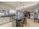 Updated kitchen with granite countertops, stainless steel appliances, and an island at 1465 Riviera Dr, Kissimmee, FL 34744