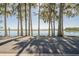 Scenic waterfront view with tall trees and calm water at 1465 Riviera Dr, Kissimmee, FL 34744