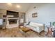 Living room features a fireplace, hardwood floors, and large TV at 1465 Riviera Dr, Kissimmee, FL 34744