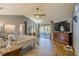 Spacious main bedroom with large TV and access to a private balcony at 1465 Riviera Dr, Kissimmee, FL 34744