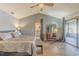 Main bedroom with king-size bed, ensuite bathroom, and access to a deck at 1465 Riviera Dr, Kissimmee, FL 34744