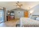 Main bedroom with king bed, large TV, and access to a deck at 1465 Riviera Dr, Kissimmee, FL 34744