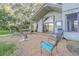 Charming patio features fire pit and backyard views at 1465 Riviera Dr, Kissimmee, FL 34744