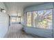 Spacious screened porch with wood flooring and water views at 1465 Riviera Dr, Kissimmee, FL 34744