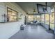 Covered porch with TV mount and seating area at 1465 Riviera Dr, Kissimmee, FL 34744
