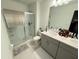 Double vanity bathroom with a large walk in shower at 1861 Roosevelt Pl, St Cloud, FL 34769