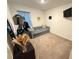 Cozy bedroom with a sofa and carpet flooring at 1861 Roosevelt Pl, St Cloud, FL 34769