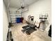 Garage with storage and workout equipment at 1861 Roosevelt Pl, St Cloud, FL 34769
