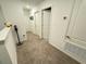 Upper level hallway with carpeted flooring and access to bedrooms at 1861 Roosevelt Pl, St Cloud, FL 34769