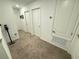 Upper level hallway with carpeted flooring and access to bedrooms at 1861 Roosevelt Pl, St Cloud, FL 34769