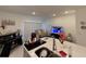 Open concept kitchen and living area with island, stainless steel appliances, and comfortable seating at 1861 Roosevelt Pl, St Cloud, FL 34769