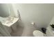 Clean and modern powder room with pedestal sink and toilet at 1861 Roosevelt Pl, St Cloud, FL 34769