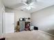 Spacious bedroom with ceiling fan and dresser at 1940 Banner Ln, Saint Cloud, FL 34769