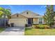 Attractive one-story house with a two-car garage and well-maintained landscaping at 1940 Banner Ln, St Cloud, FL 34769