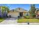 One-story house with two-car garage and landscaped lawn at 1940 Banner Ln, Saint Cloud, FL 34769