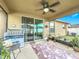 Covered patio with ceiling fan and sliding door at 1940 Banner Ln, St Cloud, FL 34769