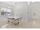 Modern dining room with a white glass table and acrylic chairs at 2101 Bunker View Ct, Kissimmee, FL 34746