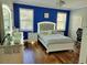 Charming bedroom with a white bed frame and blue accent wall at 2323 Jernigan Loop, Kissimmee, FL 34746