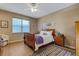 Well-lit bedroom with a queen-size bed and wood flooring at 241 Granada Ln, Davenport, FL 33837