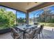 Relaxing screened patio with table and chairs, perfect for outdoor dining at 241 Granada Ln, Davenport, FL 33837