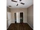 Spacious bedroom with wood-look flooring and ceiling fan at 2642 Rutledge Ct, Winter Haven, FL 33884