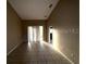 Bright and spacious living room with tile flooring and access to a back patio at 2642 Rutledge Ct, Winter Haven, FL 33884