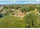 Aerial view of a house with a large backyard, pool, and surrounding land at 2801 S Granada Blvd, Kissimmee, FL 34746
