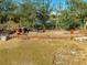 Aerial view of a horse enclosure with several stalls and animals at 2801 S Granada Blvd, Kissimmee, FL 34746