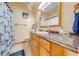 Simple bathroom with shower/tub combo and wood vanity at 2801 S Granada Blvd, Kissimmee, FL 34746