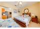 Guest bedroom with a queen bed and adjacent kitchenette at 2801 S Granada Blvd, Kissimmee, FL 34746