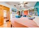 Cozy bedroom with built-in bookshelves and a queen bed at 2801 S Granada Blvd, Kissimmee, FL 34746