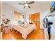 Bright bedroom with double bed and wood floors at 2801 S Granada Blvd, Kissimmee, FL 34746