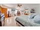 Bright bedroom with a large bed, ceiling fan, and mirrored closet doors at 2801 S Granada Blvd, Kissimmee, FL 34746