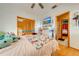 Bedroom with double bed, wood floors, and access to another room at 2801 S Granada Blvd, Kissimmee, FL 34746