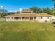 Ranch-style home with a large yard and wrap-around porch at 2801 S Granada Blvd, Kissimmee, FL 34746