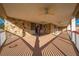 Long covered porch offers a relaxing view of the backyard at 2801 S Granada Blvd, Kissimmee, FL 34746