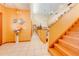 Bright hallway with tiled floors and staircase to upper level at 2801 S Granada Blvd, Kissimmee, FL 34746